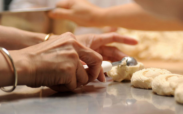 A woman's hands making shortbread cookies. 
